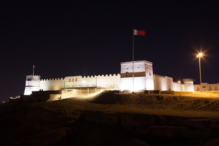 Historic Riffa Fort illuminated at night. Kingdom of Bahrain, Middle Eastのeditorial素材
