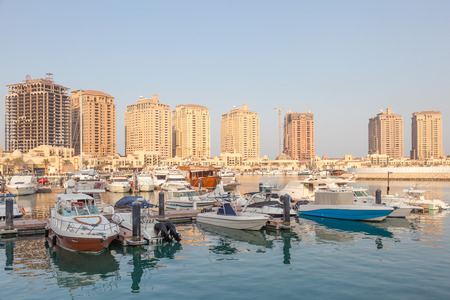 Yachts and boats at the marina of Porto Arabia. Doha, Qatar, Middle East