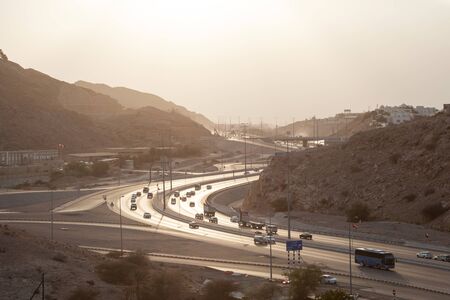 Muscat Expressway backlit from the sun in the afternoon. Muscat, Sultanate of Oman