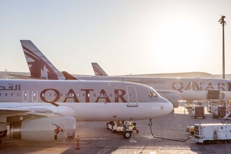 DOHA, QATAR - NOV 23: Qatar Airways aircrafts at the gate of new Doha International Airport. November 23, 2015 in Doha, Qatar, Middle Eastのeditorial素材