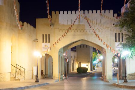 NIZWA, OMAN - NOV 25: Gate to the old town of Nizwa illuminated at night. November 25, 2015 in Nizwa, Sultanate of Oman, Middle Eastのeditorial素材