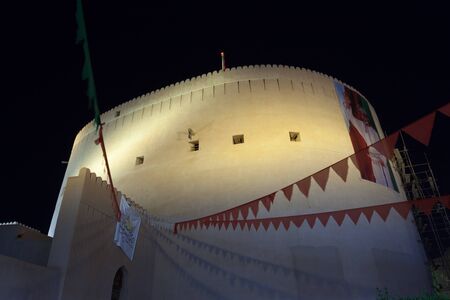 NIZWA, OMAN - NOV 25: Tower in the old town of Nizwa illuminated at night. November 25, 2015 in Nizwa, Sultanate of Oman, Middle Eastのeditorial素材