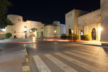NIZWA, OMAN - NOV 25: Gate to the old town of Nizwa illuminated at night. November 25, 2015 in Nizwa, Sultanate of Oman, Middle Eastのeditorial素材
