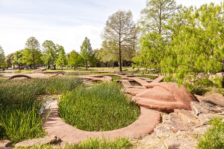 DALLAS, USA - APR 8: Saggitaria Platyphylla statue by Patricia Johanson at the Leonhardt Lagoon of the Fair Park in Dallas. April 8, 2016 in Dalls, Texas, United Statesのeditorial素材