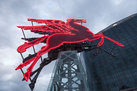 DALLAS, USA - APR 9: The 1934 Pegasus statue seen on top of the Magnolia Building was taken down in 1999. Now it is restored and placed in front of the Omni Hotel. April 9, 2016 in Dallas, Texas, USAのeditorial素材