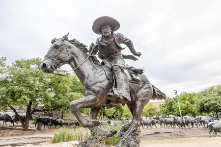 DALLAS, USA - APR 9: Cowboy statue in the city of Dallas. The Statue was gifted by Trammel Crow to the city of Dallas. April 9, 2016 in Dallas, Texas, USAのeditorial素材
