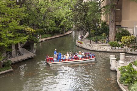 SAN ANTONIO, USA - APR 11: Sightseeing boat at the famous San Antonio River Walk. April 11, 2016 in San Antonio, Texas, United Statesのeditorial素材
