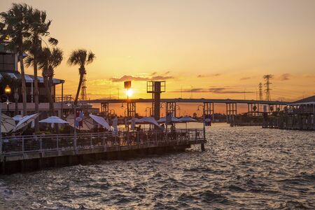 KEMAH, TX, USA - APR 14, 2016: Sunset at the Kemah Boardwalk. Kemah is a famous resort in the Galveston Bay area. Texas, United Statesのeditorial素材