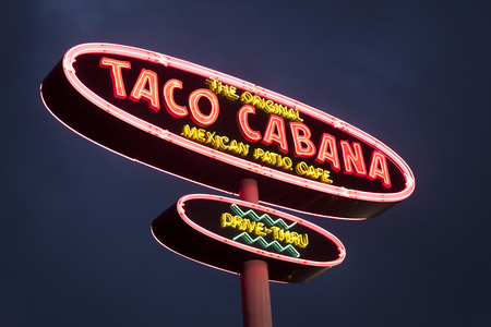 DALLAS, Tx, USA - APR 17, 2016: Taco Cabana Mexican fast food restaurant logo illuminated at night. Dallas, Texas, United Statesのeditorial素材
