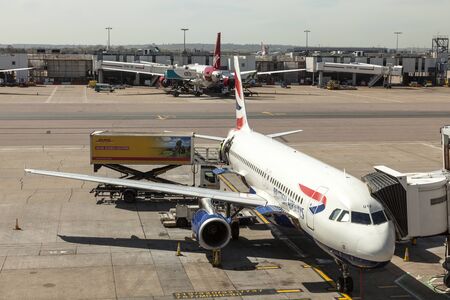 LONDON, UK - APR 20, 2016: British Airways airplanes at the terminal of London Heathrow international airport. Hillingdon, England, United Kingdom.のeditorial素材