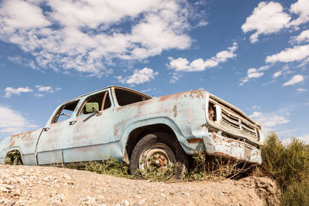 Old abandoned pickup truck in the desertの写真素材