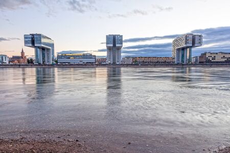 COLOGNE, GERMANY - AUG 7, 2016: The three Crane Houses at the Rhine river in Cologne illuminated at dusk. North Rhine-Westphalia, Germanyのeditorial素材