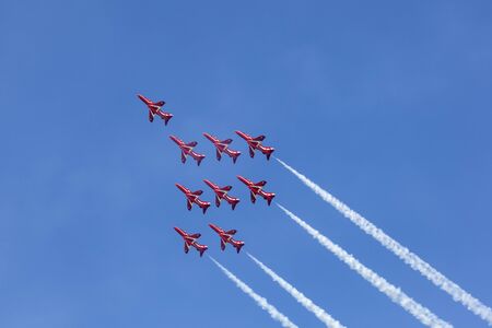 ABU DHABI, UAE - NOV 24, 2016: Royal Air Force Aerobatic Team Red Arrows performs in an airshow over...
