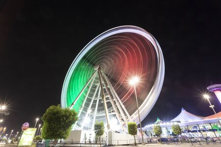 ABU DHABI, UAE - NOV 26, 2016: Marina Eye ferris wheel illuminated at night. City of Abu Dhabi, United Arab Emiratesのeditorial素材