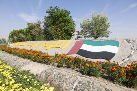 UAE national flag monument in a roundabout in Liwa Oasis. Emirate of Abu Dhabi, United Arab Emirates, Middle Eastのeditorial素材