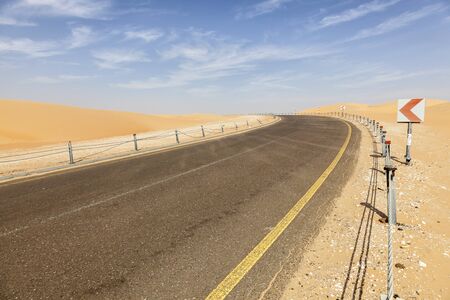 Desert road to the Moreeb Dune in Liwa Oasis area. Emirate of Abu Dhabi, United Arab Emirates