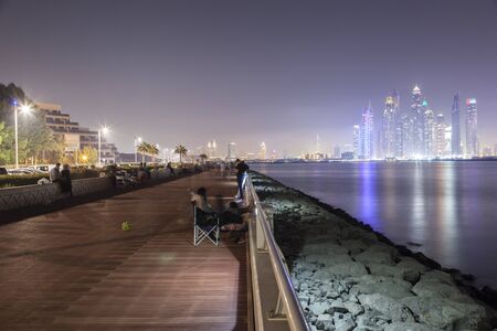 DUBAI, UAE - DEC 2, 2016: Promenade at the Palm Jumeirah with Dubai Marina Skyline in the background. United Arab Emirates, Middle Eastのeditorial素材