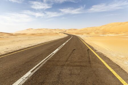 Desert road to the Moreeb Dune in Liwa Oasis area. Emirate of Abu Dhabi, United Arab Emiratesの写真素材
