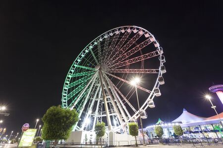 ABU DHABI, UAE - NOV 26, 2016: Marina Eye ferris wheel at the Marina Mall illuminated at night. Abu Dhabi, United Arab Emiratesのeditorial素材
