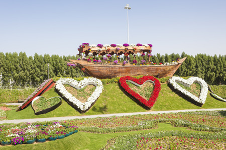 DUBAI, UAE - NOV 27, 2016: Hearts made of flowers and a historic arabian dhow ship at the Miracle Garden in Dubai. United Arab Emirates, Middle Eastのeditorial素材