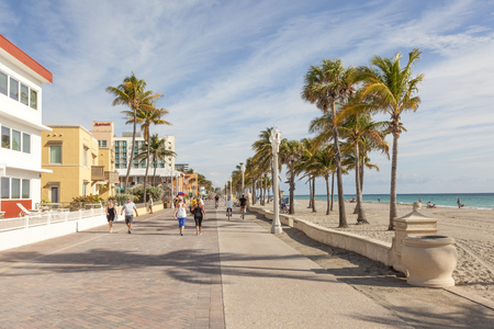 Hollywood Beach, Fl, USA - March 13, 2017: People strolling at the Hollywood Beach Broad Walk on a sunny day in March. Florida, United Statesのeditorial素材