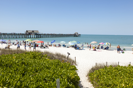 Naples, Fl, USA - March 18, 2017: Beautiful white sand beach at the Gulf of Mexico coast in Naples. Florida, United Statesのeditorial素材