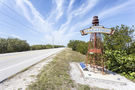 Marathon Key, Fl, USA - March 16, 2017: Welcome to Marathon Key sign on a lighthouse at the road side. Florida, United Statesのeditorial素材