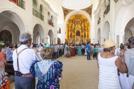 El Rocio, Spain - June 2, 2017: Group of pilgrims in traditional spanish dress in the hermitage of El Rocio during the Romeria 2017. Andalusia, Spainのeditorial素材