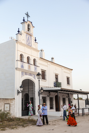 El Rocio, Spain - June 1, 2017: Piilgrims in traditional spanish dress in front of a curch in El Rocio during the Romeria 2017. Andalusia, Spainのeditorial素材