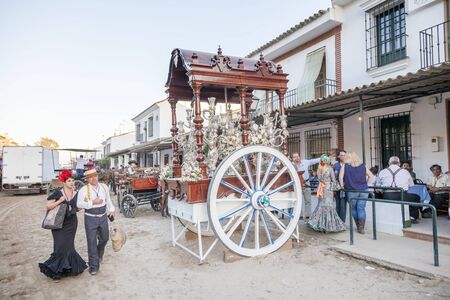 El Rocio, Spain - June 4, 2017: Piilgrims in traditional spanish dress in front of the hermitage in El Rocio during the Romeria 2017. Andalusia, Spainのeditorial素材