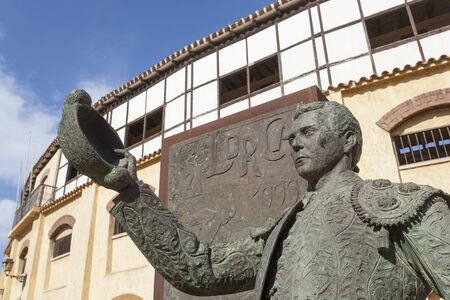 Lorca, Spain - May 29, 2017: Historic bullfight arena in Lorca with monument to the famous torero Pepin Jimenez. Province of Murcia, Spainのeditorial素材