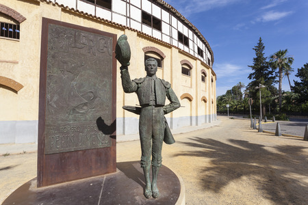 Lorca, Spain - May 29, 2017: Historic bullfight arena in Lorca with monument to the famous torero Pepin Jimenez. Province of Murcia, Spainのeditorial素材