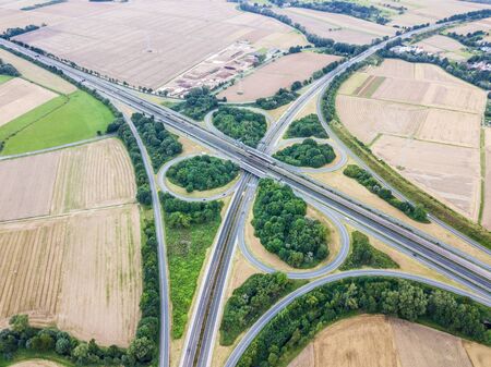 Aerial view of a highway intersection with a clover-leaf interchange