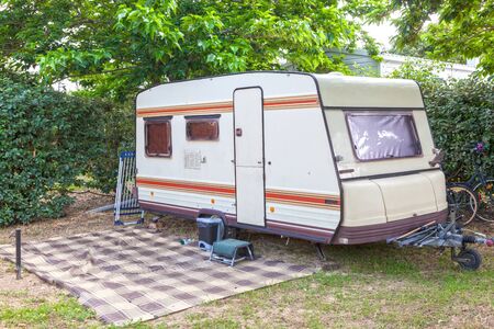 Classic caravan trailer on a camping siteの写真素材