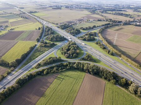 Aerial view of a highway intersection with a clover-leaf interchange