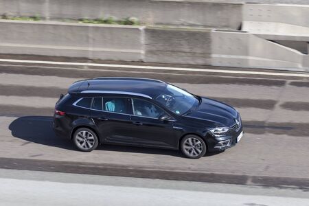 Frankfurt, Germany - Sep 19, 2017: Black Renault Megane GrandTour driving on the highway in Germany