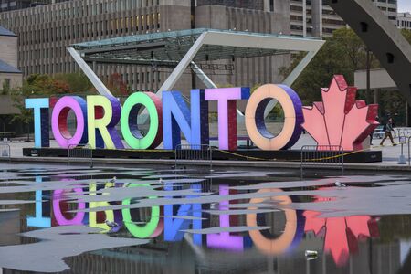 Toronto, Canada - Oct 11, 2017: Colorful illuminated Toronto sign at the Nathan Phillips Square in...