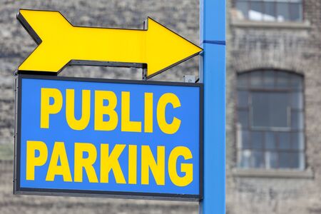 Blue and yellow public parking sign