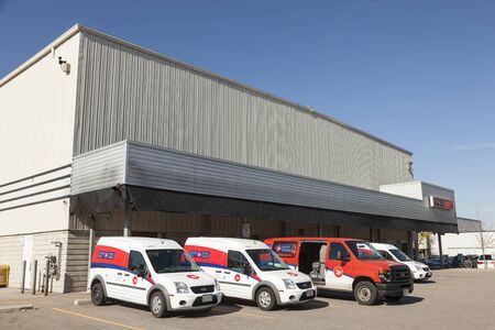 Toronto, Canada - Oct 17, 2017: Canada Post mail delivery trucks at a depot in Toronto. Province of Ontario, Canadaのeditorial素材