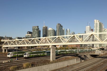Toronto, Canada - Oct 20, 2017: Skyline of Toronto downtown. Go doubledecker train in the foreground. City of Toronto, Canadaのeditorial素材