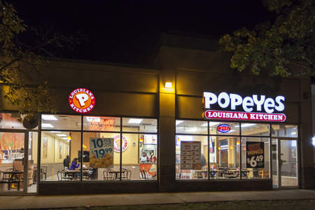 Toronto, Canada - Oct 19, 2017: Popeyes Louisiana Kitchen fast food restaurant illuminated at night.のeditorial素材