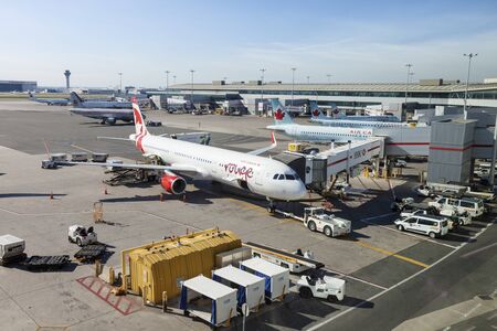 Toronto, Canada - Oct 22, 2017: Air Canada and rouge airplanes at the Toronto Pearson International Airport, Canadaのeditorial素材