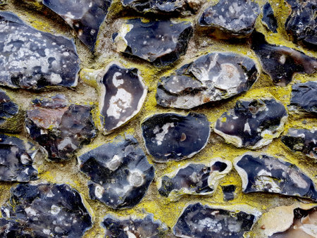 Detail of an old flint stone wall texture. Close-up. Selective focus.の写真素材
