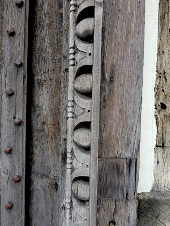 Carved wooden door of an old house, close-up. Background