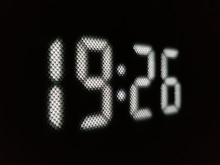 White led numbers on a black background, close-up of numbers.の写真素材