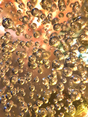 Bubbles in a glass of champagne as an abstract background.