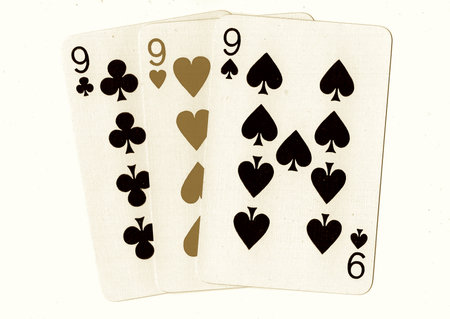 Playing cards isolated on a white background, closeup of photo.の写真素材