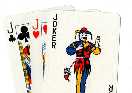 Playing cards on a white background, with the image of a clown