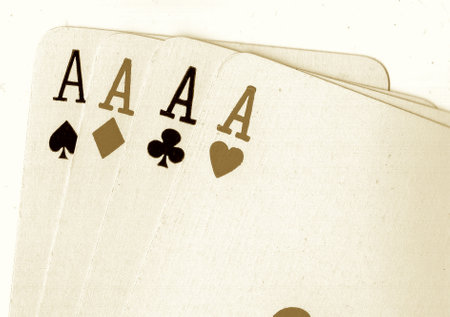 playing cards on a white background in a casino, retro toned