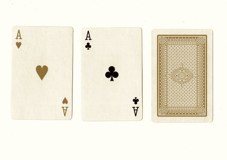 Playing cards isolated on white background. Vintage style toned image.